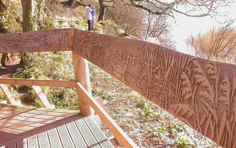 Hand rail carved with wildlife view