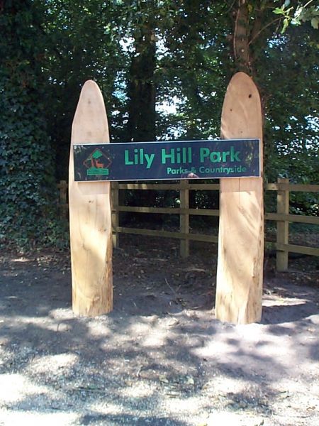 Large wood and metal park entrance sign