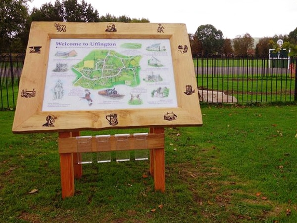 information map housed in a large wooden carved frame