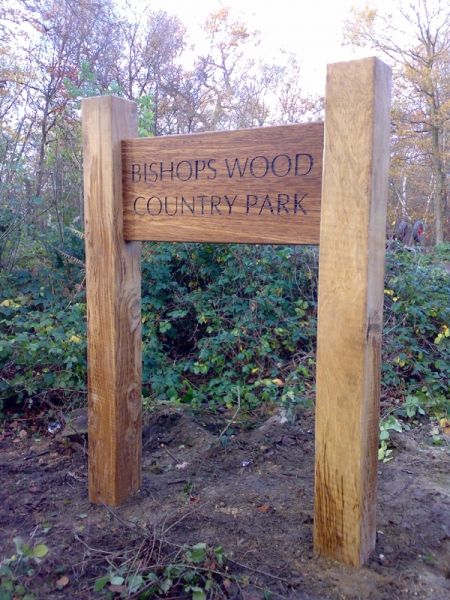 Large wooden entrance sign to a park