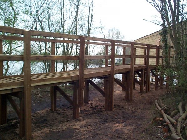raised wooden boardwalk to elevated bird hide Emberton Country Park