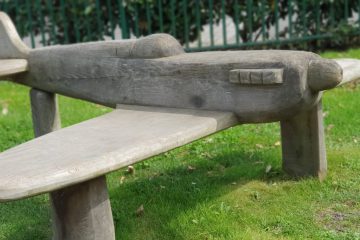 Wooden Spitfire bench on grass