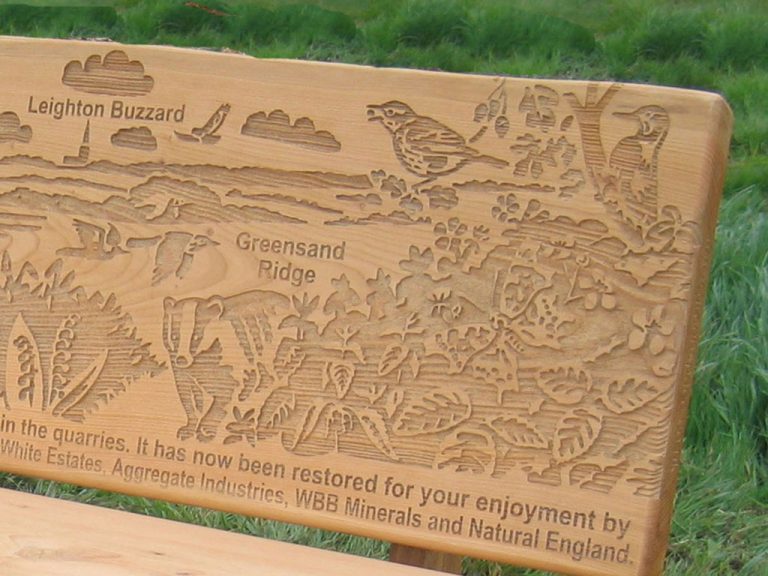 detail of wildlife etching on bench