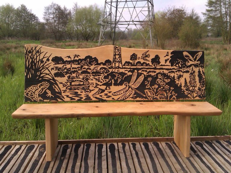 Wooden bench with local wildlife view carved into the backrest