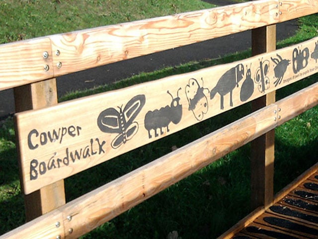 Boardwalk rail etched artwork
