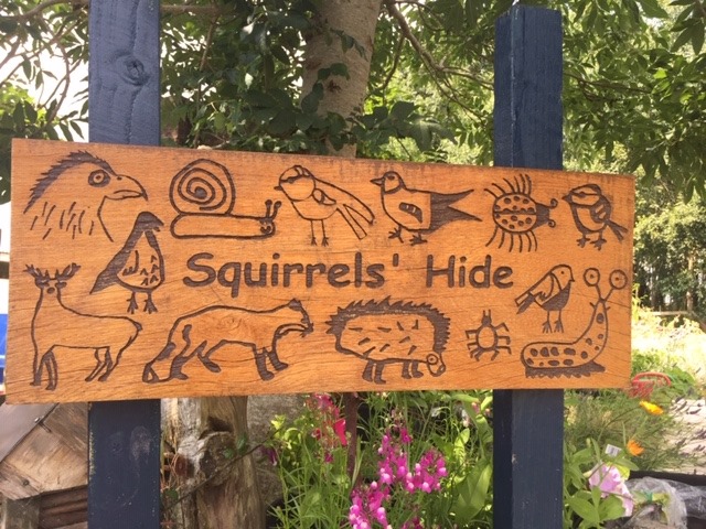 Playground sign with children's animal drawings