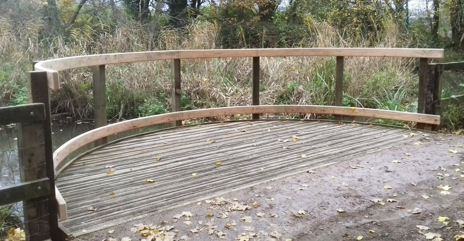 curved wooden pond dipping handrails